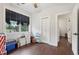 Light-filled bedroom with wood floors and a view of the yard at 411 Johnson Rd, Locust Grove, GA 30248