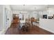 Bright and airy dining area with hardwood floors, chandelier, and open layout at 411 Johnson Rd, Locust Grove, GA 30248