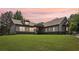 Charming gray house on a lush green lawn with a beautifully designed exterior and a welcoming entrance at 411 Johnson Rd, Locust Grove, GA 30248