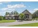 Charming single-story home with gray siding, stone accents, manicured lawn, and well-maintained landscaping at 411 Johnson Rd, Locust Grove, GA 30248