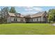 Lovely single story home with gray siding, stone accents, and a spacious green lawn at 411 Johnson Rd, Locust Grove, GA 30248