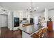 Spacious kitchen features sleek countertops, a large island with seating, and modern stainless steel appliances at 411 Johnson Rd, Locust Grove, GA 30248