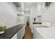 Functional laundry room with front load washer and dryer, countertop, and ample storage space at 411 Johnson Rd, Locust Grove, GA 30248