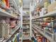 Walk-in pantry providing ample storage with rows of shelving stocked with food and supplies at 411 Johnson Rd, Locust Grove, GA 30248