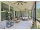 Inviting screened-in porch with ceiling fans and views of the outdoors at 411 Johnson Rd, Locust Grove, GA 30248