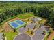 An aerial shot featuring the community pool, a tennis court and clubhouse at 6080 Simone St, Acworth, GA 30101