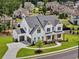 Aerial view of home, showing a beautifully landscaped lawn and an attractive neighborhood at 6080 Simone St, Acworth, GA 30101