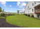 Landscaped yard featuring a screened in porch, with ample space for outdoor activities at 6080 Simone St, Acworth, GA 30101