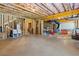 Unfinished basement with exposed wood studs and playful activity area at 6080 Simone St, Acworth, GA 30101