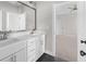 A well-lit bathroom with double sinks and a large mirror at 6080 Simone St, Acworth, GA 30101