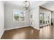 Bright breakfast nook with natural light, hardwood floors, and french doors leading to a deck at 6080 Simone St, Acworth, GA 30101