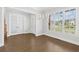 Spacious dining room with a view of the front yard and staircase to upper level at 6080 Simone St, Acworth, GA 30101