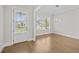 Bright dining room with wood floors, natural light and modern light fixture at 6080 Simone St, Acworth, GA 30101