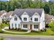 Charming two-story white home with a landscaped yard, perfectly situated in a peaceful, wooded neighborhood at 6080 Simone St, Acworth, GA 30101