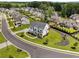 Aerial view of a two-story home in a neighborhood with sidewalks and lush landscaping at 6080 Simone St, Acworth, GA 30101
