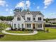 Two-story white home with a landscaped yard and an inviting front porch, perfect for enjoying quiet moments at 6080 Simone St, Acworth, GA 30101