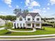 Beautiful two-story white home with a landscaped yard, complemented by a charming walkway to the front door at 6080 Simone St, Acworth, GA 30101