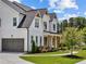 Beautiful two-story home featuring white siding, a gray roof and gray garage door at 6080 Simone St, Acworth, GA 30101