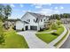 Aerial view of a two-story home boasting a three-car garage and manicured lawn at 6080 Simone St, Acworth, GA 30101