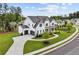 A beautiful two-story home featuring a three-car garage and manicured lawn at 6080 Simone St, Acworth, GA 30101