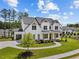 Two-story white home with an attached garage, nestled among trees and offering a welcoming landscaped front yard at 6080 Simone St, Acworth, GA 30101