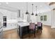 Modern kitchen with stainless appliances, a central island and hardwood floors at 6080 Simone St, Acworth, GA 30101