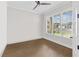 Bright office with a ceiling fan, wood floors and large windows at 6080 Simone St, Acworth, GA 30101