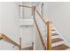 Traditional staircase featuring wood treads, white risers, and a light wood handrail at 6080 Simone St, Acworth, GA 30101