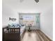 Cozy bedroom with nautical decorations, a daybed, and bright natural light from the window at 1802 Lexington Green Pnes, Cumming, GA 30040