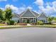 Attractive clubhouse exterior with beautiful landscaping and welcoming entrance at 1802 Lexington Green Pnes, Cumming, GA 30040