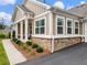 Beautiful home exterior with stone accents, manicured landscaping, and a paved driveway at 1802 Lexington Green Pnes, Cumming, GA 30040