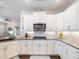 This kitchen offers modern cabinetry, stainless appliances, and ample countertop space, perfect for cooking at 1802 Lexington Green Pnes, Cumming, GA 30040