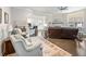 Open-concept living area with fireplace, hardwood floors and seamless flow to the kitchen at 1802 Lexington Green Pnes, Cumming, GA 30040