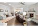 Spacious living room with fireplace, hardwood floors, and easy access to the kitchen at 1802 Lexington Green Pnes, Cumming, GA 30040