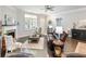 Cozy living room with a fireplace, neutral decor, and comfortable seating, creating an inviting atmosphere at 1802 Lexington Green Pnes, Cumming, GA 30040
