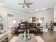 Comfortable living room featuring hardwood floors, ample seating, and lots of natural light at 1802 Lexington Green Pnes, Cumming, GA 30040