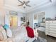 This bright main bedroom shows an ensuite with a large dresser and decor at 1802 Lexington Green Pnes, Cumming, GA 30040