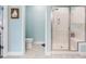 Shower features glass doors and a built in bench, with a toilet and scale nearby at 1802 Lexington Green Pnes, Cumming, GA 30040