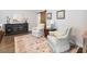 Bright sitting area featuring hardwood floors and comfortable chairs at 1802 Lexington Green Pnes, Cumming, GA 30040