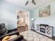 Sitting room opens to the main bedroom with comfortable seating and decor at 1802 Lexington Green Pnes, Cumming, GA 30040
