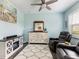Sitting room shows a small fireplace, a beach themed painting and a large comfortable recliner at 1802 Lexington Green Pnes, Cumming, GA 30040