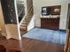 Spacious foyer featuring a staircase, hardwood floors, and decorative mirror at 2380 Cain Cir, Dacula, GA 30019