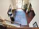 Open entryway featuring hardwood floors, a staircase, and a view of the front door at 2380 Cain Cir, Dacula, GA 30019