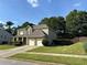 Traditional home with a two car garage and beautifully maintained lawn at 2380 Cain Cir, Dacula, GA 30019