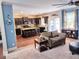 Open concept living space with kitchen, seating area, and hardwood floors at 2380 Cain Cir, Dacula, GA 30019