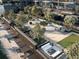 Aerial view showcases a rooftop terrace with various seating areas, lush trees and community green space at 788 W Marietta Nw St # 1404, Atlanta, GA 30318