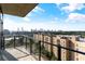 Downtown city skyline from condo balcony featuring black metal and glass railings at 788 W Marietta Nw St # 1404, Atlanta, GA 30318