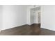 Empty bedroom with hardwood floors, white walls, and ample closet space at 788 W Marietta Nw St # 1404, Atlanta, GA 30318
