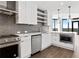 Contemporary kitchen with stainless steel appliances, and open shelving plus island and pendant lights at 788 W Marietta Nw St # 1404, Atlanta, GA 30318