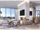 Open-concept living room featuring hardwood flooring, stone accent wall, and city views at 788 W Marietta Nw St # 1404, Atlanta, GA 30318